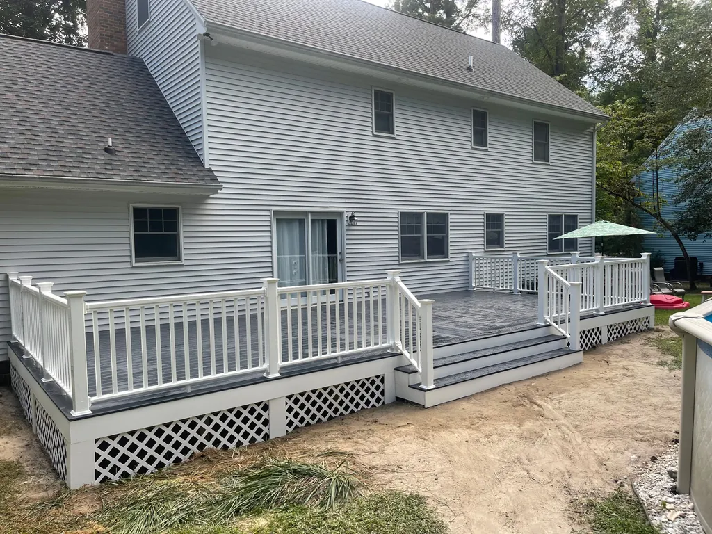 Finished deck with white railings on the back of a home in Salisbury, Maryland