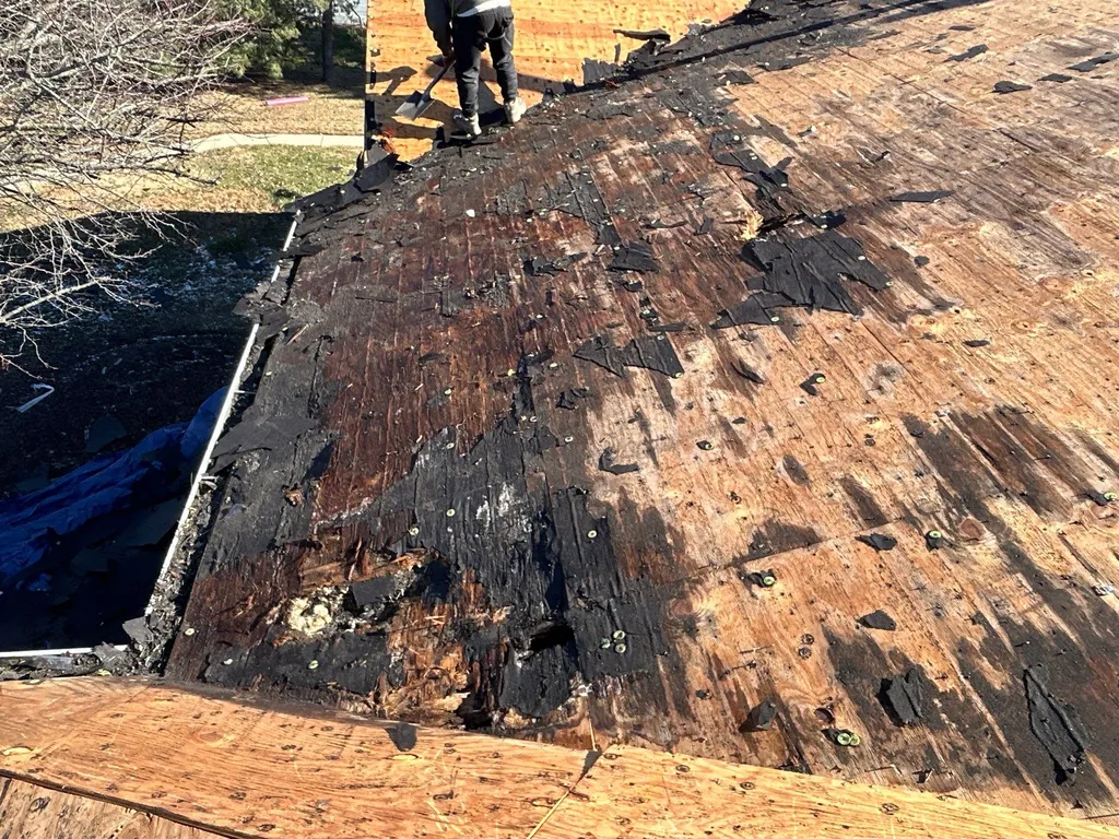 Rotted roof decking exposed during tear-off by Precision Exteriors